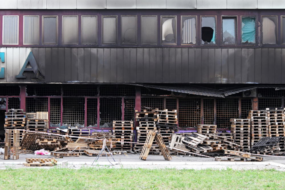 Empty pallet stacks that contributed to a fire.