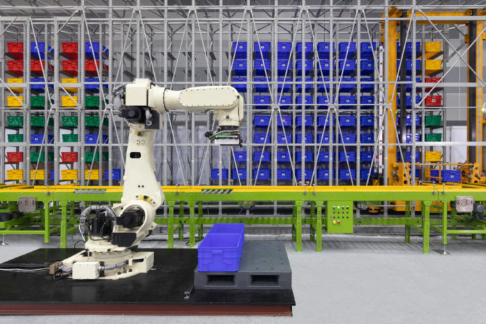 Palletizing being performed by a robotic arm.