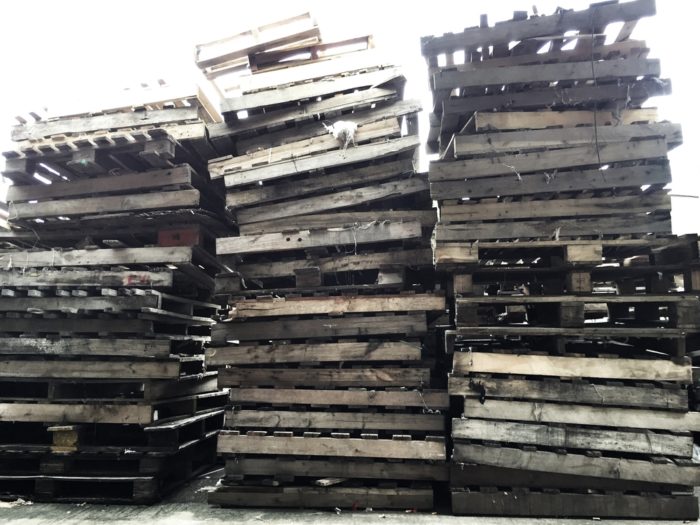 Damaged wood pallets show the state of the pallet market