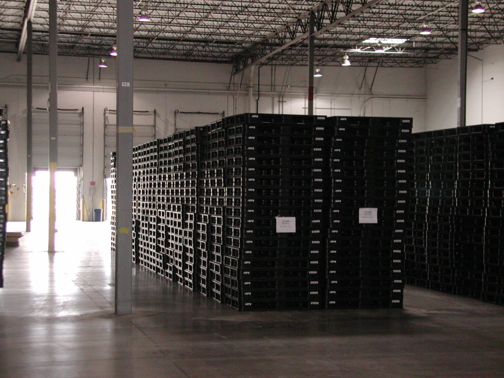 Idle pallet storage in a warehouse bay.
