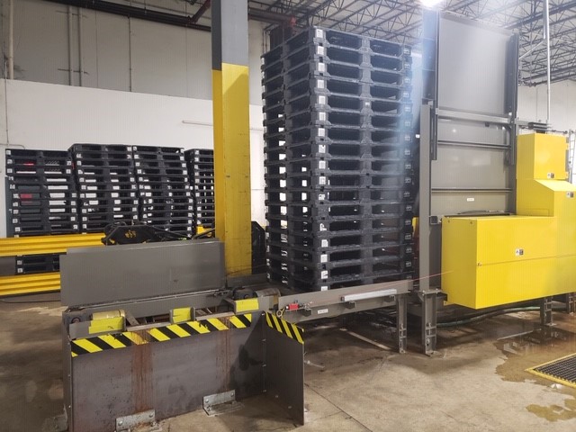 Plastic pallets being washed to reenter the pallet pool