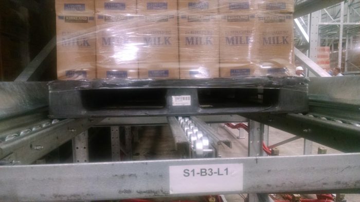 Plastic pallets used with gravity racking