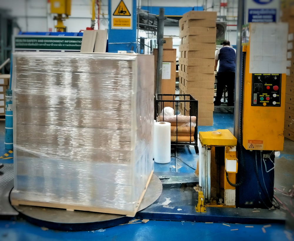 Pallet of products being plastic wrapped.