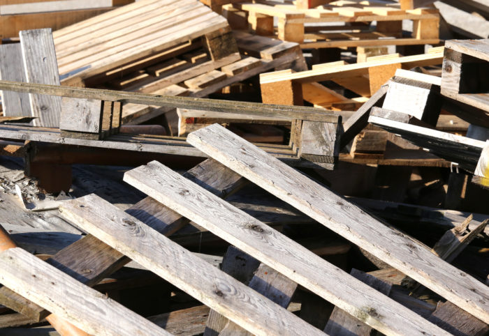 Used wood pallets in a landfill.