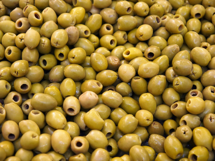 Olives may contain pits, but this is considered natural and not foreign object contamination.