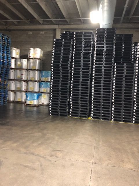 Plastic pallets in warehouse storage
