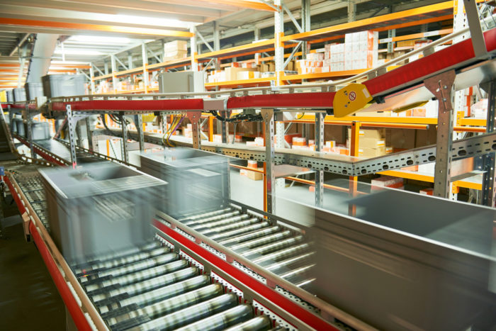 Using automated conveyors to move products through the warehouse