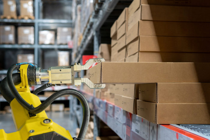 Robot arm stocks warehouse shelf
